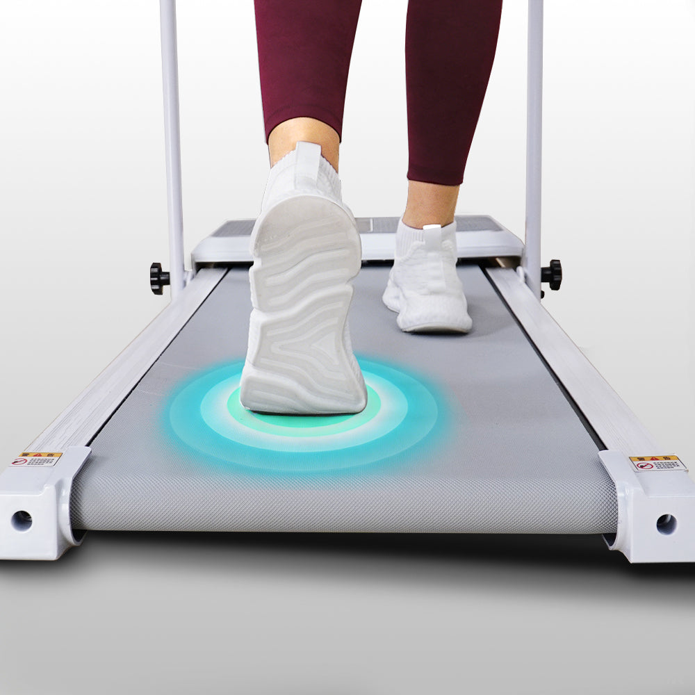 Walking treadmill close-up showing protective mat detail
