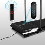 Walking treadmill close-up showing remote control and LCD display panel
